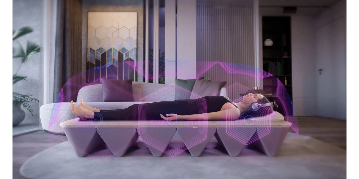 woman laying on Opus Vibroacoustic Sound Bed