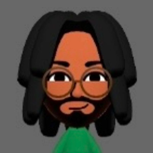 Cartoon avatar with glasses, beard, and long hair on a gray background.