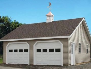 vinyl 2 car garage with wooden floor