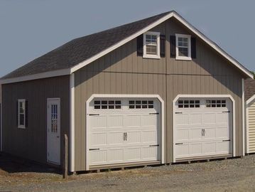 2 car 2 story garage with wooden floor
