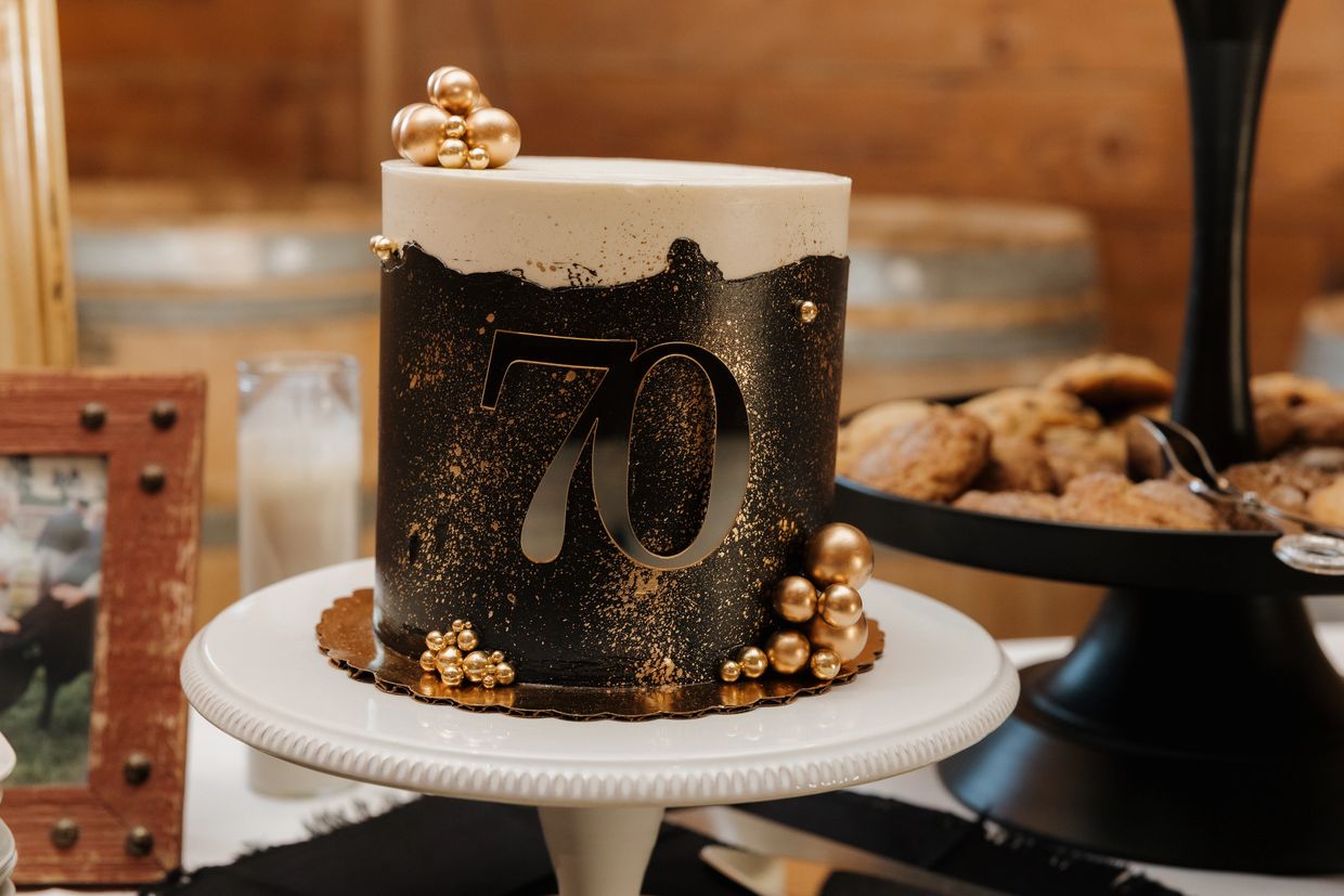 Elegant black and gold 70th birthday cake.