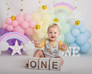 pastel rainbow cake smash theme