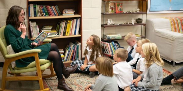 students listening to a teacher