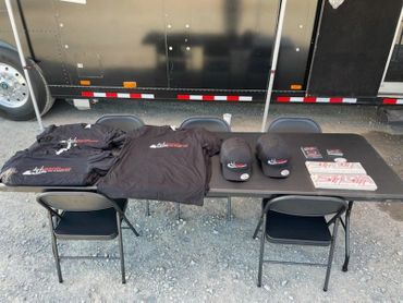 Hats, shirts, stickers for drivers that stop by