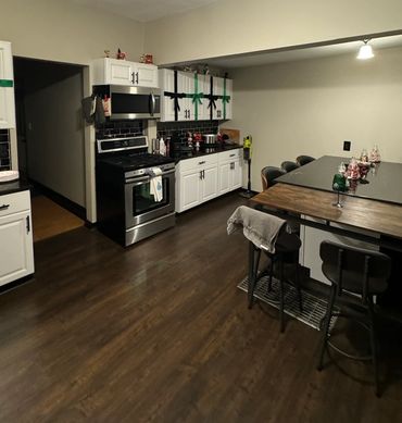 Completed kitchen renovation with updated cabinets, flooring and appliances in Cape Coral.