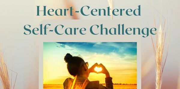 women with hands in heart shape around sunset