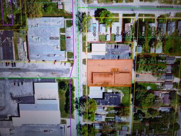 Aerial view of urban area with buildings and streets.