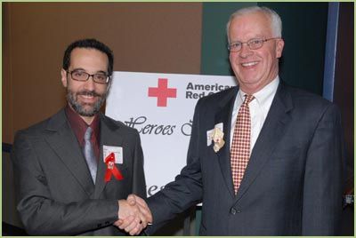 Craig Hendrickson, President and CEO of Overlake Hospital, awards the Red Cross Hero Award, Dec 2006