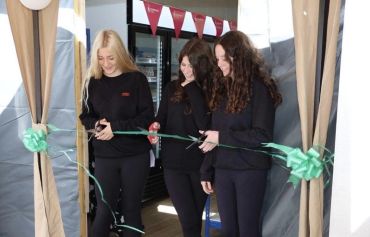 Tarbert Academy pupils Ellie, Eva and Lucy cutting the ribbon on the new Foodbank premises.