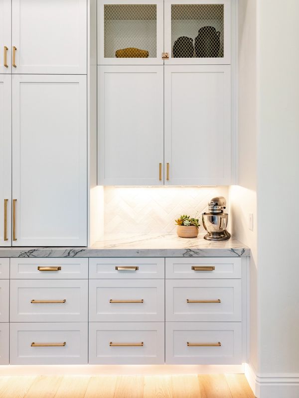 Custom kitchen cabinets with screen detail.