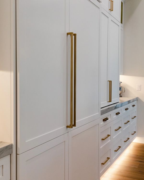 Concealed appliances and appliance garage with matching kitchen door styles.