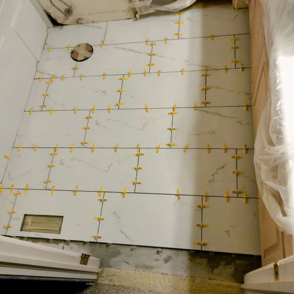 During picture of bathroom floor remodel