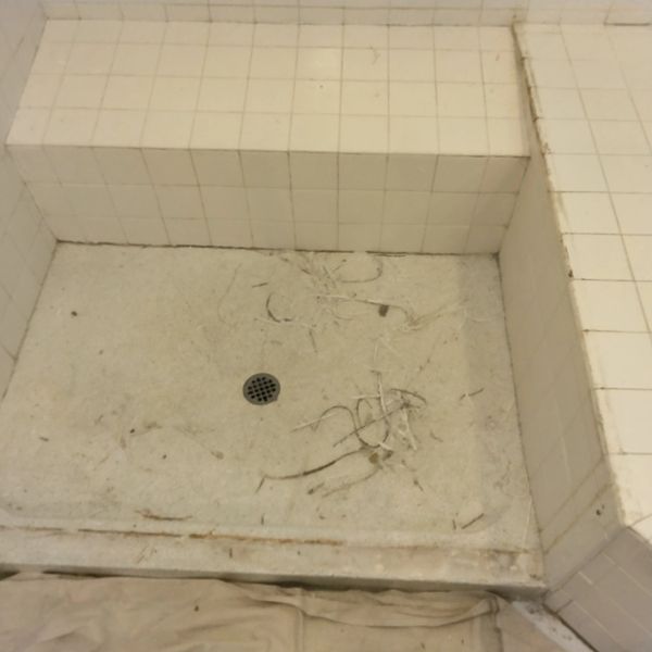 BEFORE RE CAULKING OF BATHROOM SHOWER WITH SEAT, OLD CAULK WAS CUT OUT AND NEW CAULK WILL BE INSTALL