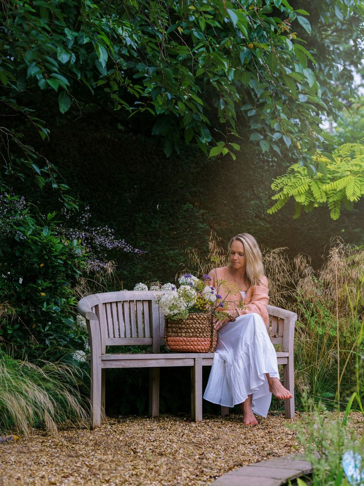 woman sitting on the garden bench