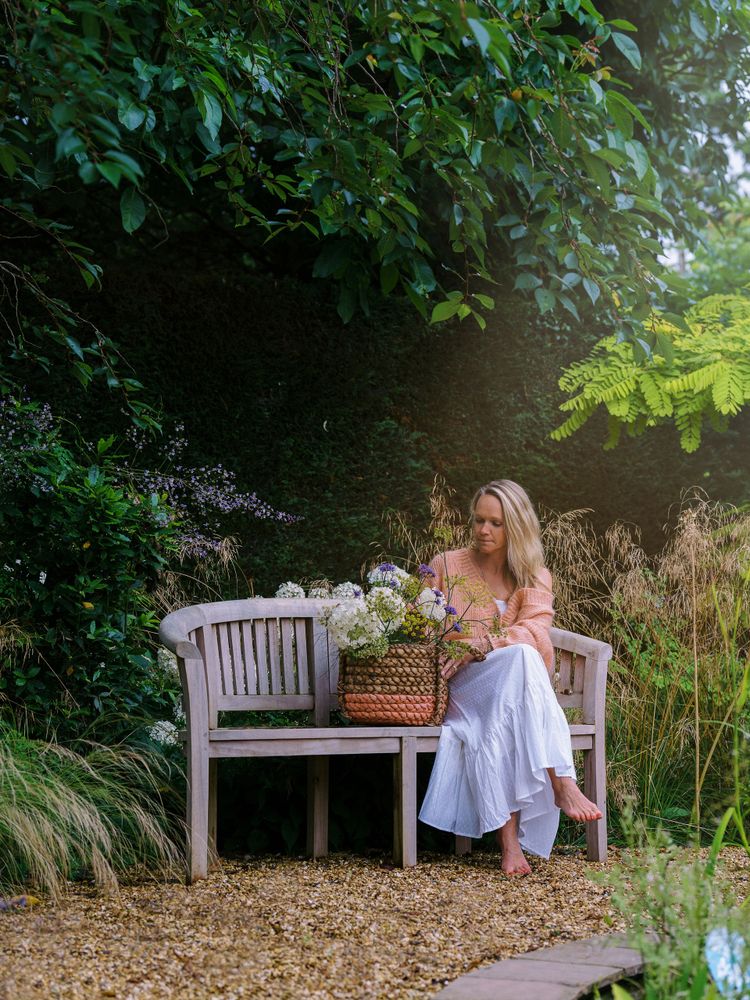 woman sitting on the garden bench 