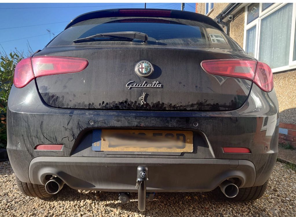 Black Alfa Romeo Giulietta fitted with a Tow-Trust detachable towbar fitted by Go-Tow ltd