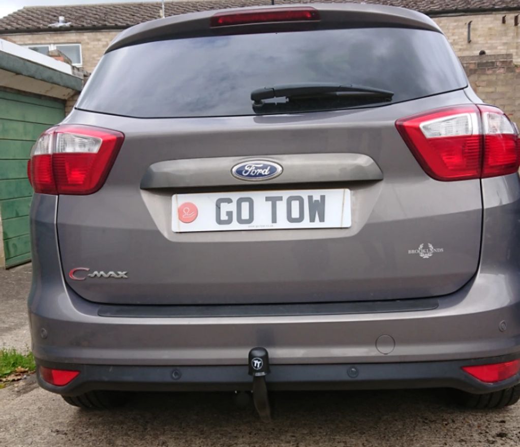Grey Ford C-Max fitted with a fixed tow-trust towbar by go-tow ltd