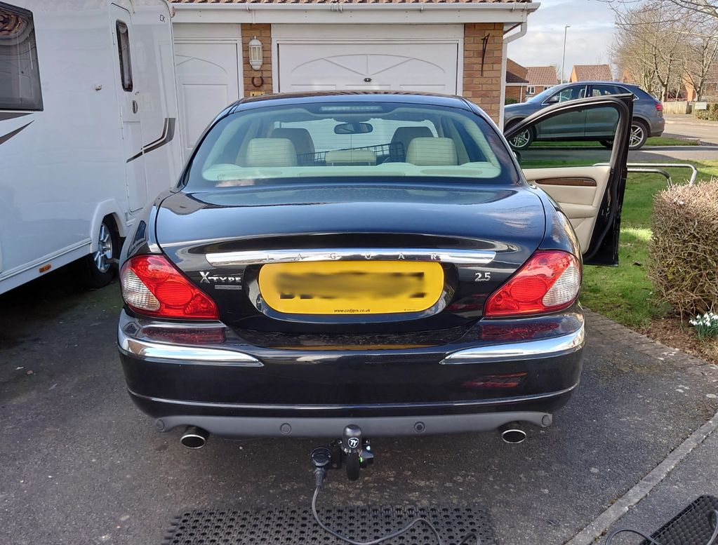 Black Jaguar X Type fitted with a detachable Tow-Trust Tow Bar