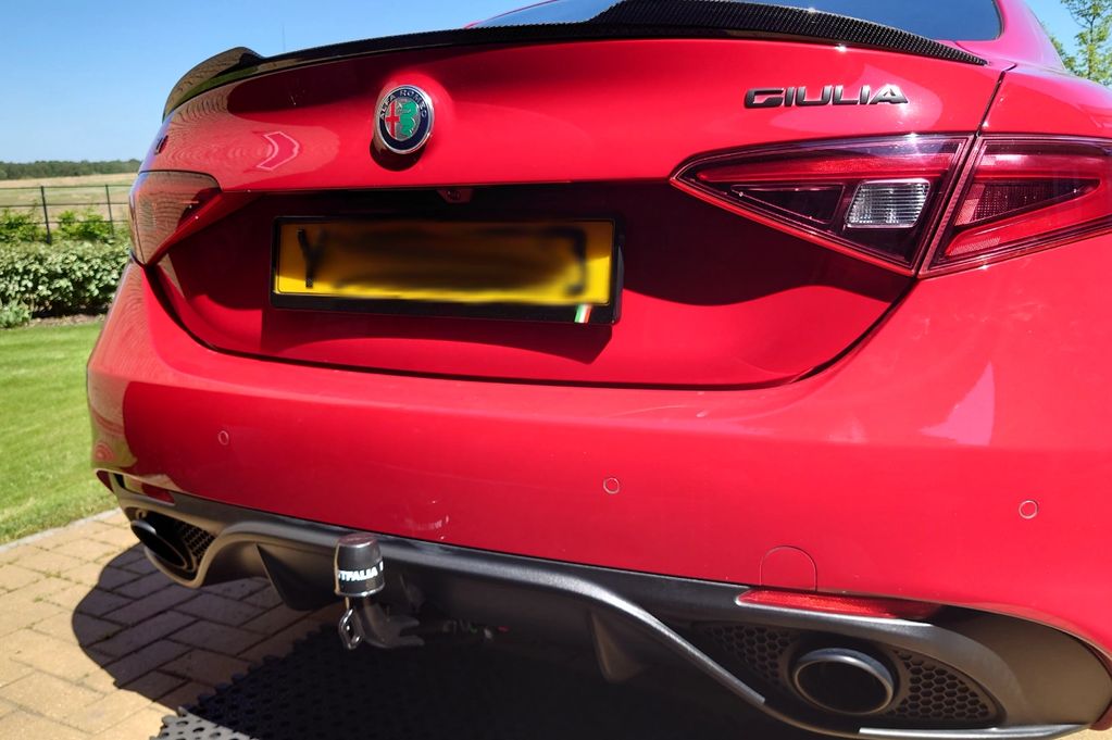 Red Alfa Romeo Giulia fitted with a detachable westfalia towbar by go-tow ltd