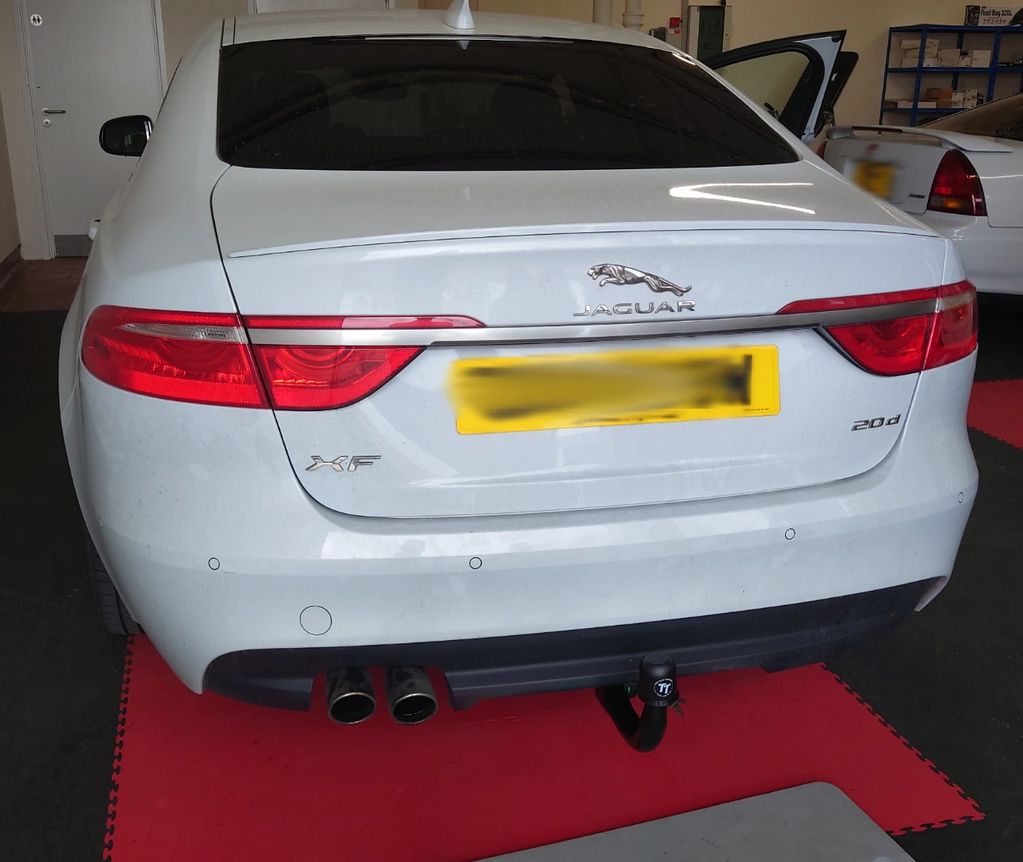 White Jaguar XF fitted with a detachable Tow-Trust Tow Bar 