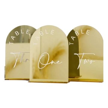 Table numbers with gold base and white lettering and white numbers.