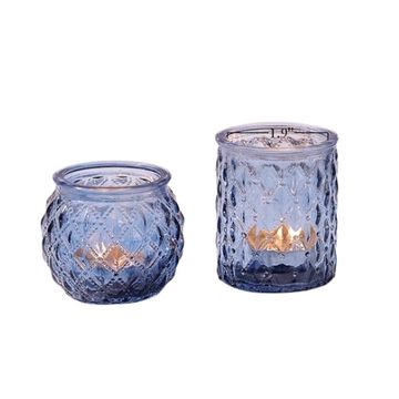 Circular or cylinder shaped blue votive candle holders.