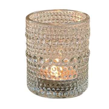 Cylinder shaped clear votive candles with a textured design.