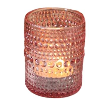 Cylinder shaped pink votive candle with a textured design.