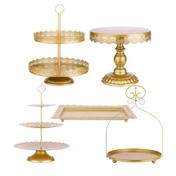 Various different sizes and shaped gold display stands.