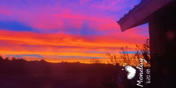 Vibrant sunset with purple and orange hues.