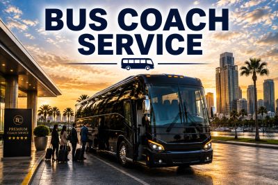 Luxury bus coach service at sunset in city.