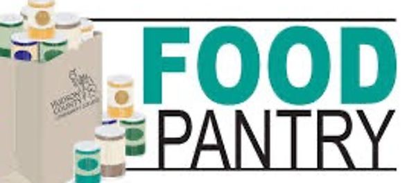 Food pantry sign with groceries and canned goods.
