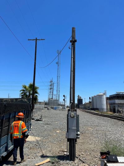 Commercial electrician inspecting electrical panels in Long Beach, CA.