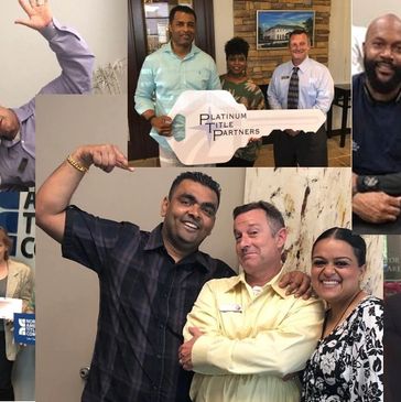 Group of smiling colleagues celebrating with a large key prop.