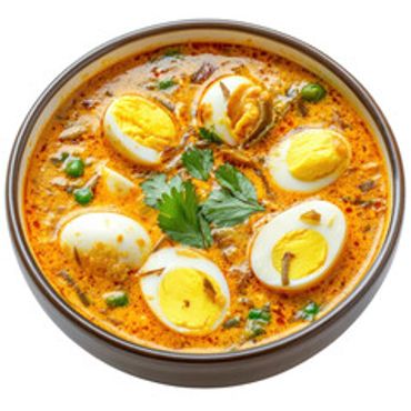 Bowl of egg curry garnished with herbs and spices.