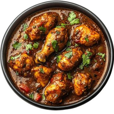 Spicy chicken drumsticks cooked in rich, flavorful sauce garnished with fresh cilantro.