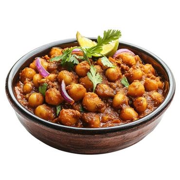 Bowl of spicy chickpea curry garnished with cilantro, lemon, and onions.