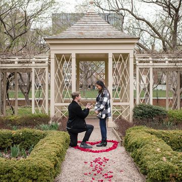 Man on knee proposing at 18th Century Gardens in Philadelphia. Proposal photographer philadelphia
