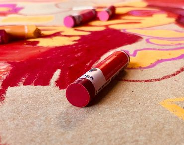 Red and pink oil pastels from the "Just Warming Up" session
