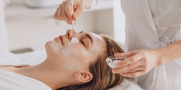 This woman is getting a chemical peel at About Skin Spa in Ocala, FL. She is calm, excited, happy.