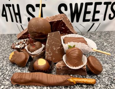 Assortment of chocolate treats on a granite surface.