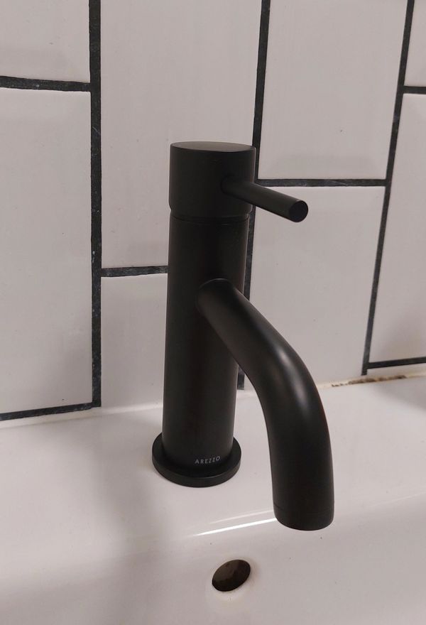 A new modern bathroom mixer tap installed in Ware