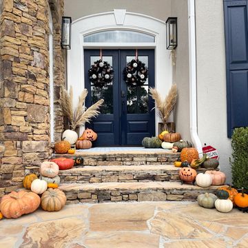 House styled with pumpkins and pampas grass for a fall welcome - the Classic Entry package