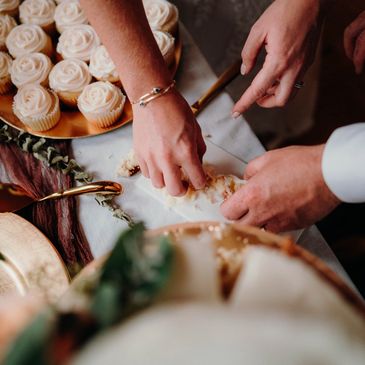 wedding cake and cupcakes