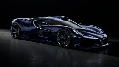 Sleek black futuristic sports car in dark setting.