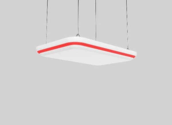 Modern white ceiling lamp with red accent, suspended by wires.