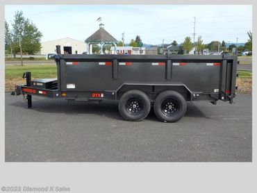 Side view of a gray dump trailer