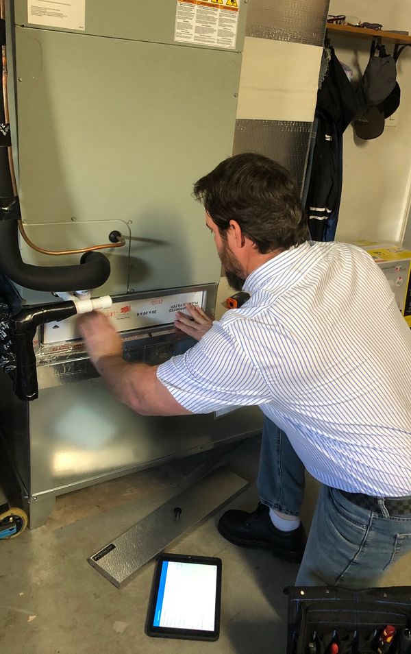 home inspector checking the HVAC system