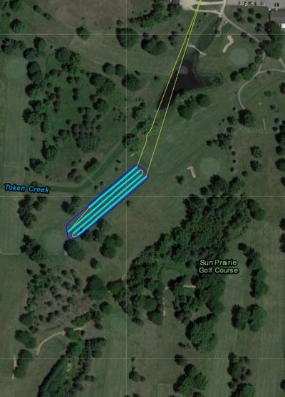 Drone spraying golf fairway