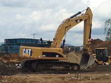 Opérateur pelle mécanique Cat-345 axco aménagements